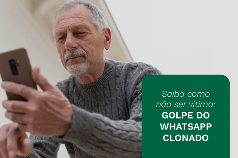 Homem grisalho segurando o celular ao lado da frase "Saiba como não se vítima: golpe do WhatsApp clonado".